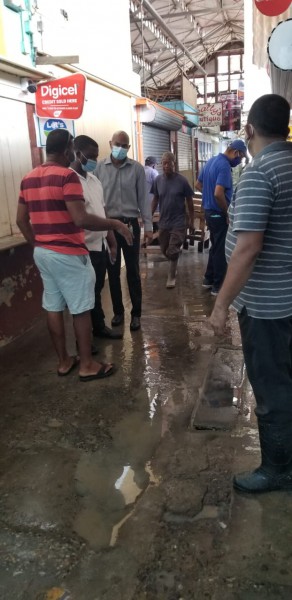 The Team on the ground meeting with vendors in the flooded market